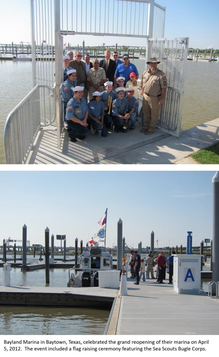 Bayland Marina reopening with boats docked at the marina, clear skies, and calm waters in the background.