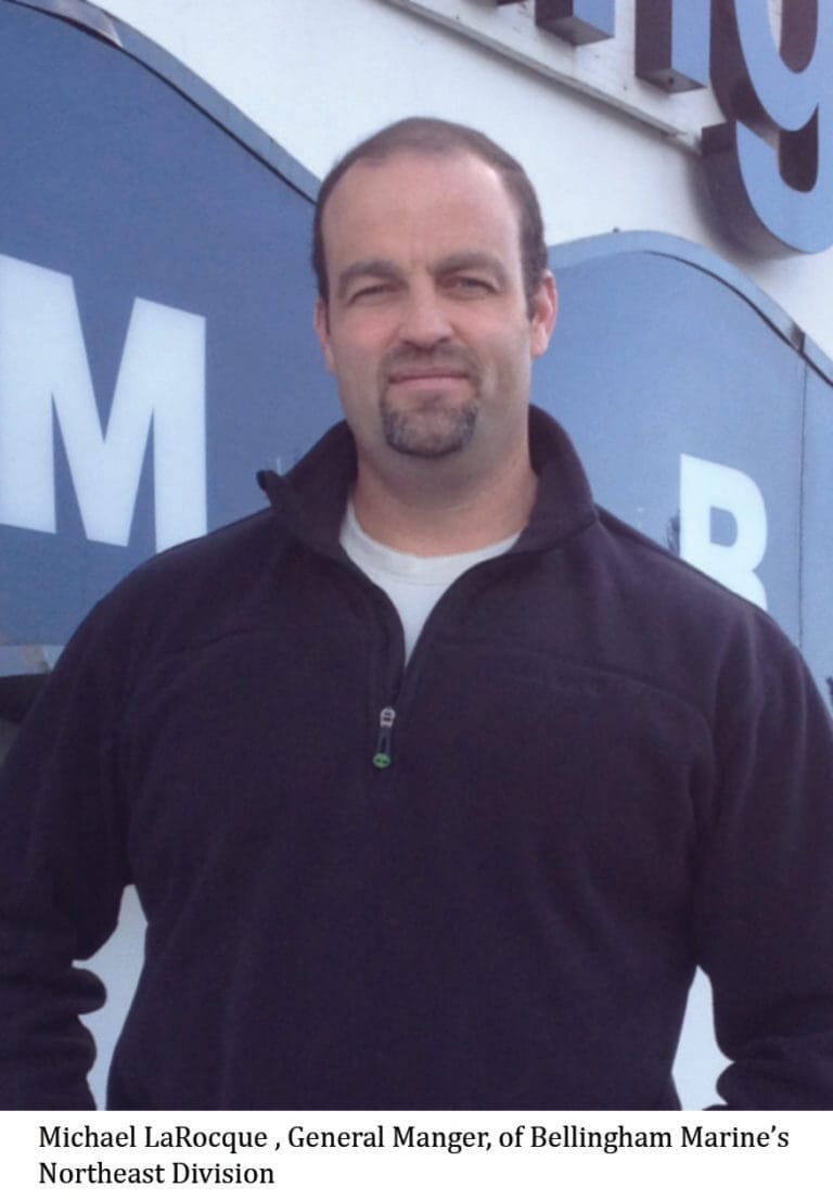Michael LaRocque, new general manager of Bellingham Marine Northeast Division, wearing a suit and smiling at the camera.