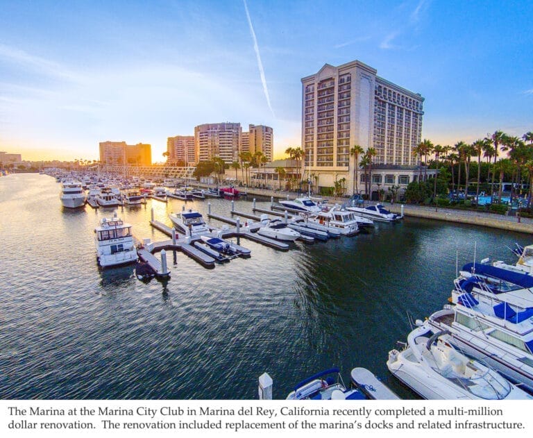 Concrete floating docks at Marina City Club, part of Marina del Rey dock system overhaul, with boats moored alongside.