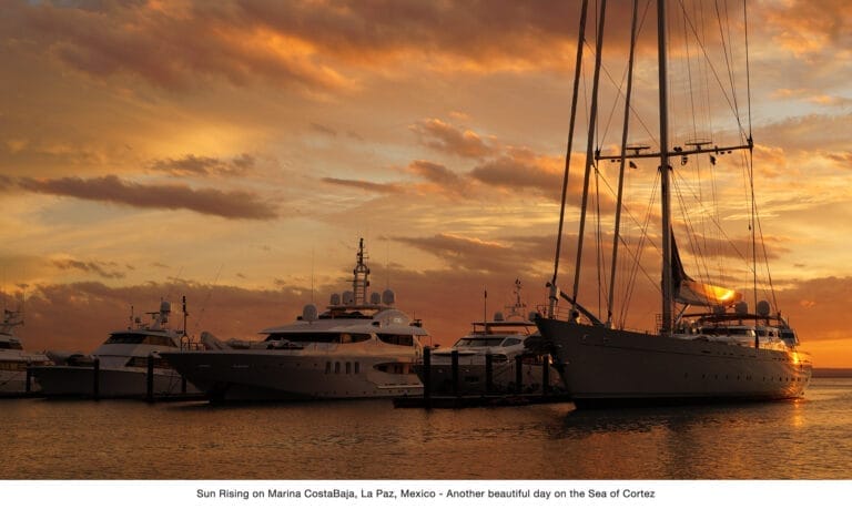 A serene marina scene with boats docked at sunset, capturing the essence of the marina photo contest 2025.