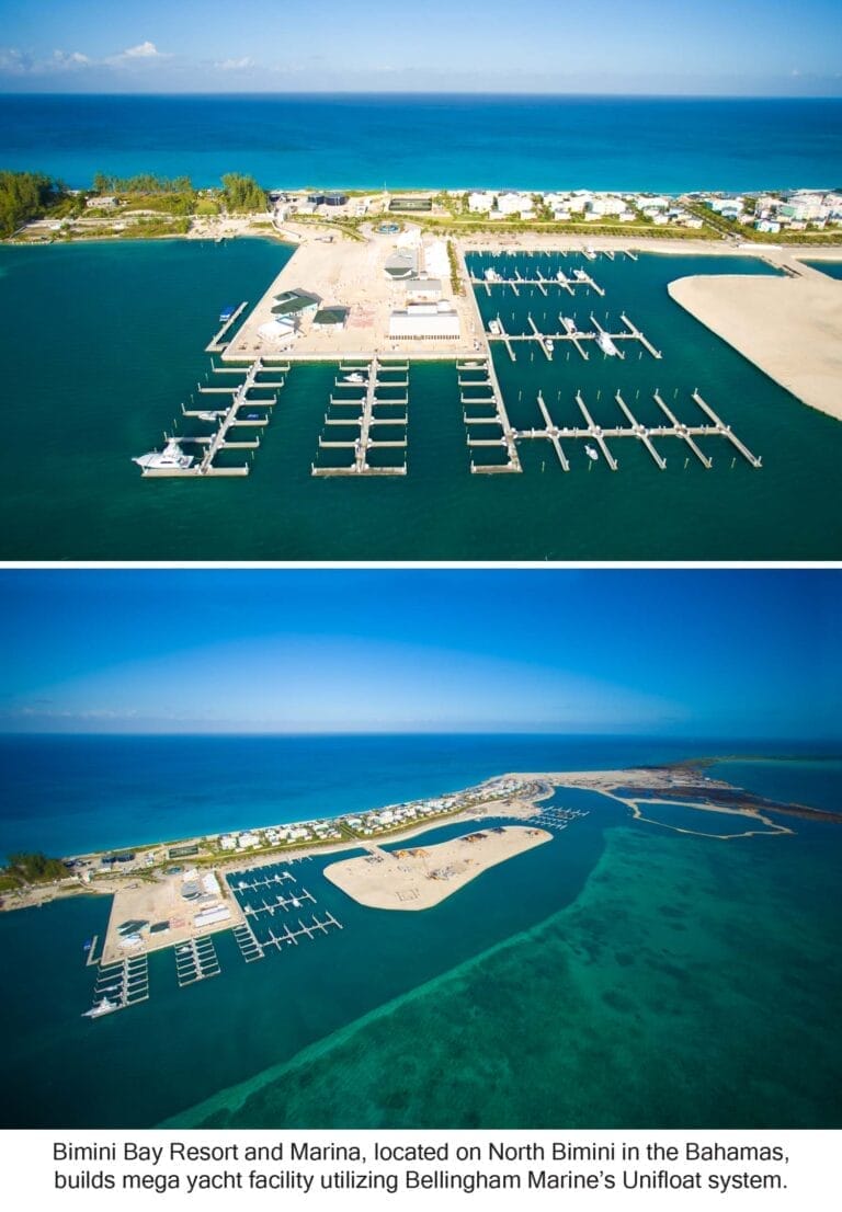 Mega yachts docked at the Bimini Bay mega yacht facility, with clear blue water and a sunny sky in the background.