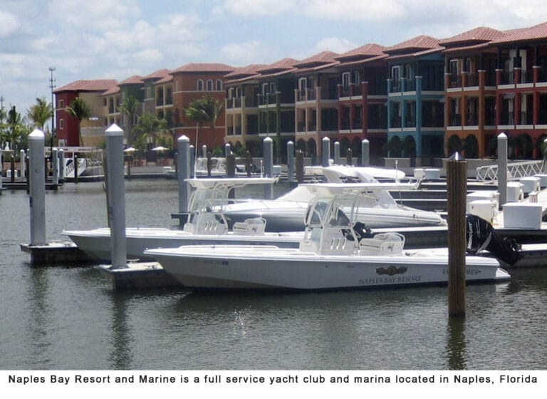 full service yacht club Naples - Aerial view of a full service yacht club in Naples with multiple docks and yachts, surrounde