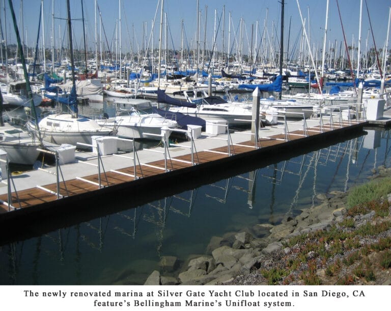 Construction workers and equipment at Silver Gate Yacht Club renovation site, showcasing progress and structural updates.