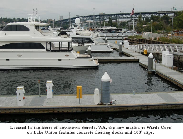 Aerial view of megayacht marina Wards Cove in downtown Seattle, showcasing large yachts docked at modern piers with city skyl