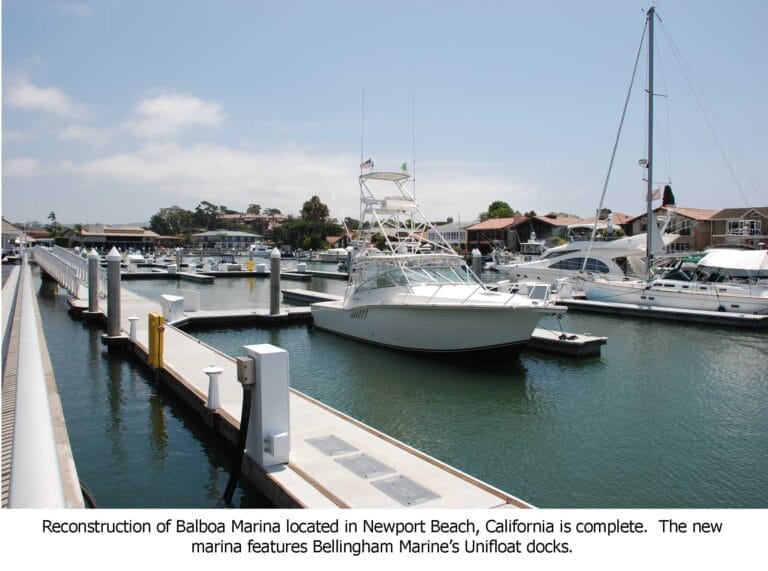 Balboa Marina renovation Newport Beach features modern docks and boats moored under a clear sky.