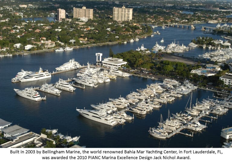 Bahia Mar Yachting Center award winner, showcasing a marina with yachts docked along the piers under a clear blue sky.