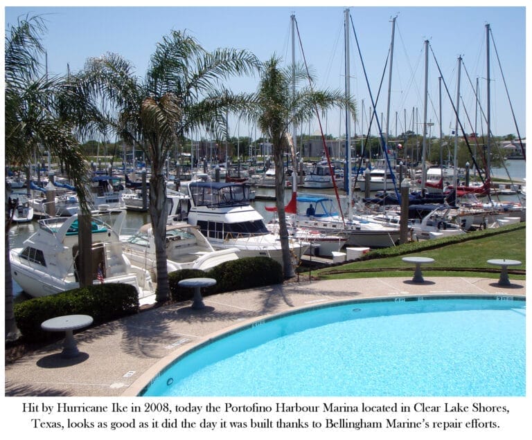 Crews working on Portofino Harbour Marina repairs, with workers and equipment visible near the waterfront.