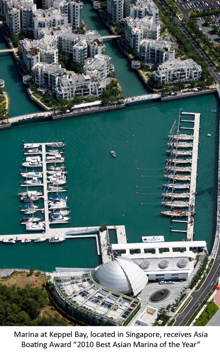 Aerial view of Marina at Keppel Bay with yachts docked, awarded Best Asian Marina 2026, surrounded by lush greenery and citys