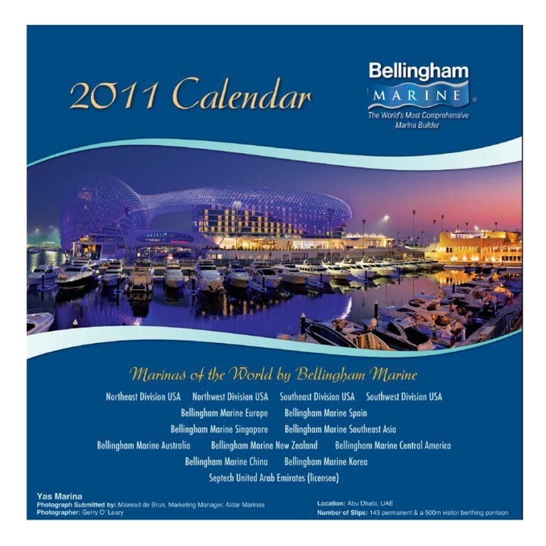 A scenic marina view featured in the Bellingham Marine 2011 calendar, showcasing boats docked under a clear blue sky.