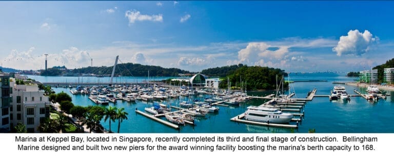 superyacht berths Singapore - Superyachts docked at Marina at Keppel Bay, Singapore, with a clear sky and calm waters, highli