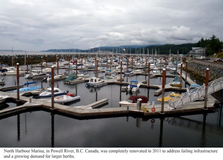 Aerial view of Powell River Marina moorage expansion showing new docks and boats in a scenic coastal setting.