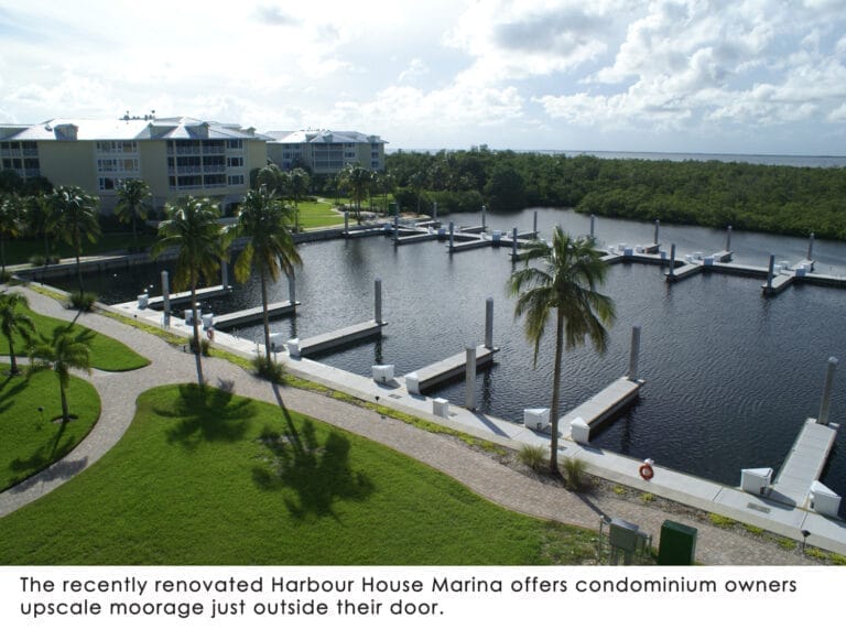 Aerial view of Harbour House marina upgrade with boats docked along modernized piers, showcasing the enhanced facilities.