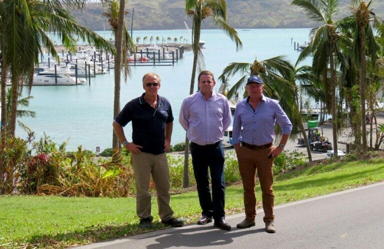 Workers repairing a marina dock in the Whitsunday Islands as part of Cyclone Debbie marina recovery efforts.