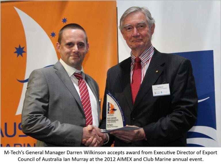 M-Tech team celebrates marine export industry success with award, showcasing their achievement in small exporter category.