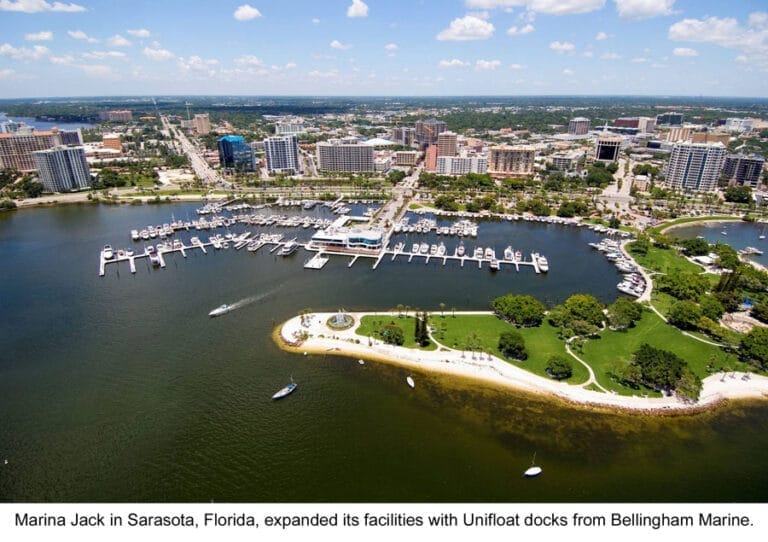 Aerial view of Marina Jack new docks in Sarasota, Florida, featuring numerous boats docked along the waterfront.
