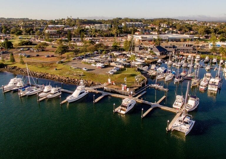 Aerial view of Port Macquarie Marina with boats docked, related to Bryce Fisher project development.