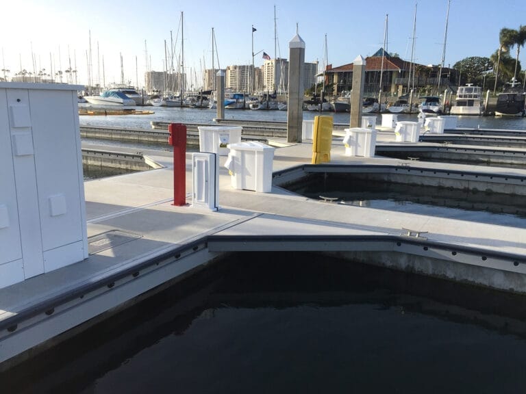 Dock with FRP components for marina longevity, featuring durable materials and a scenic waterfront view.
