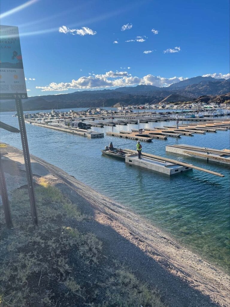 Aerial view of Lake Mohave dock system upgrade at Katherine Landing, featuring new docks and boat slips surrounded by water.