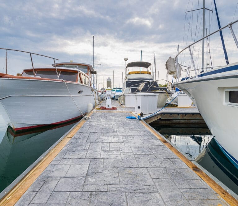 Stamped concrete surface on a Unifloat dock, showcasing the modular concrete dock system in a marina setting.