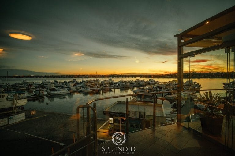 Aerial view of the St George Motor Boat Club marina expansion, showcasing new docks and boats against a waterfront backdrop.